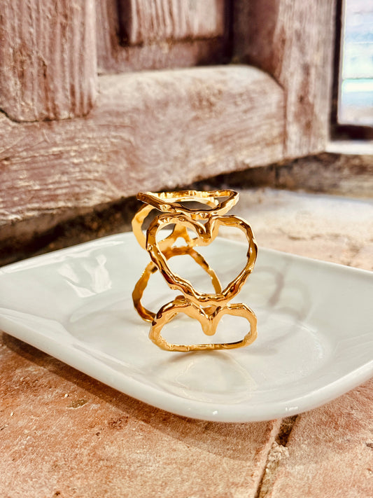 Brazalete de acero inoxidable dorado – Corazones entrelazados Les Trouvailles de Tolède